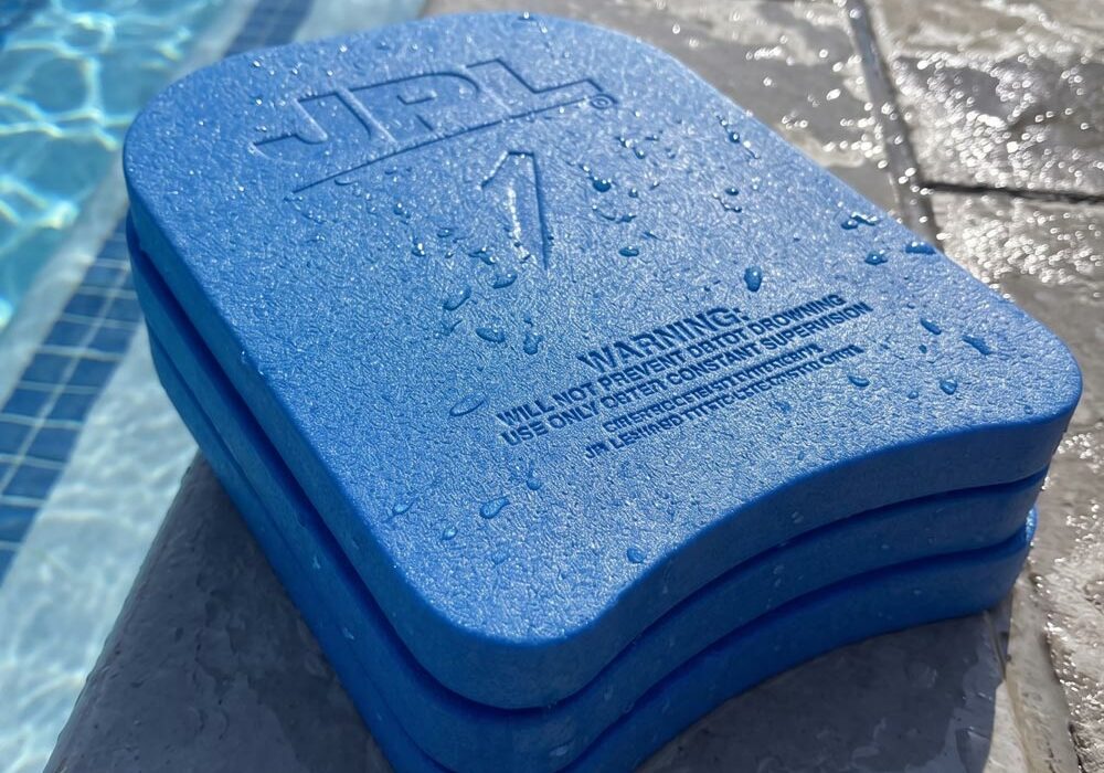 Azote foam products AZOTE foam buoyancy aids on the side of a swimming pool