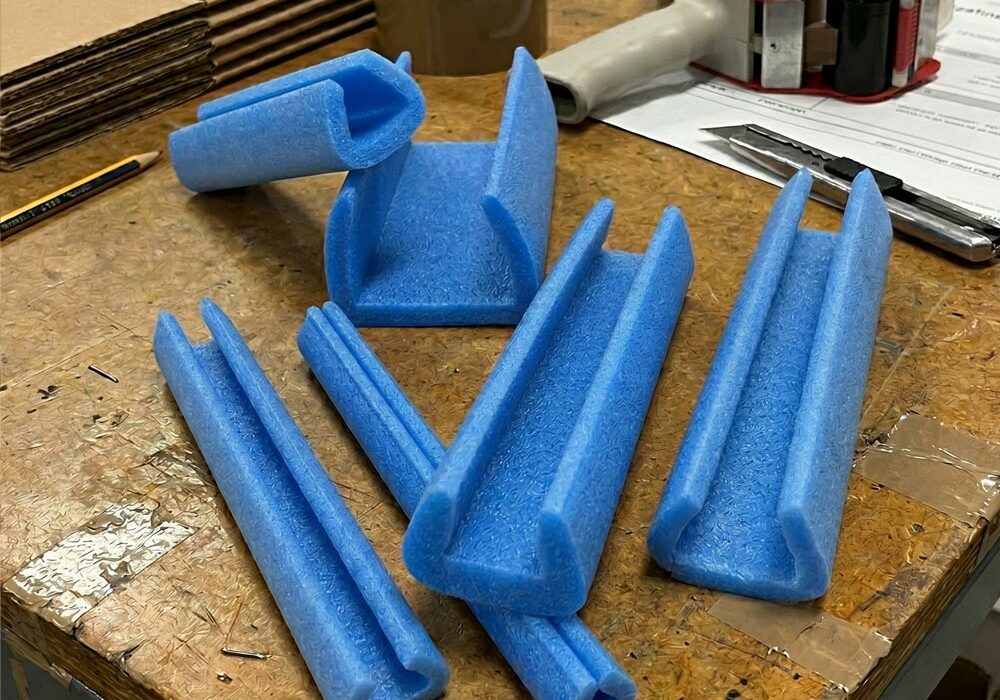 Edge protection foam strips Edge protection foam strips on a workbench in a fulfilment centre
