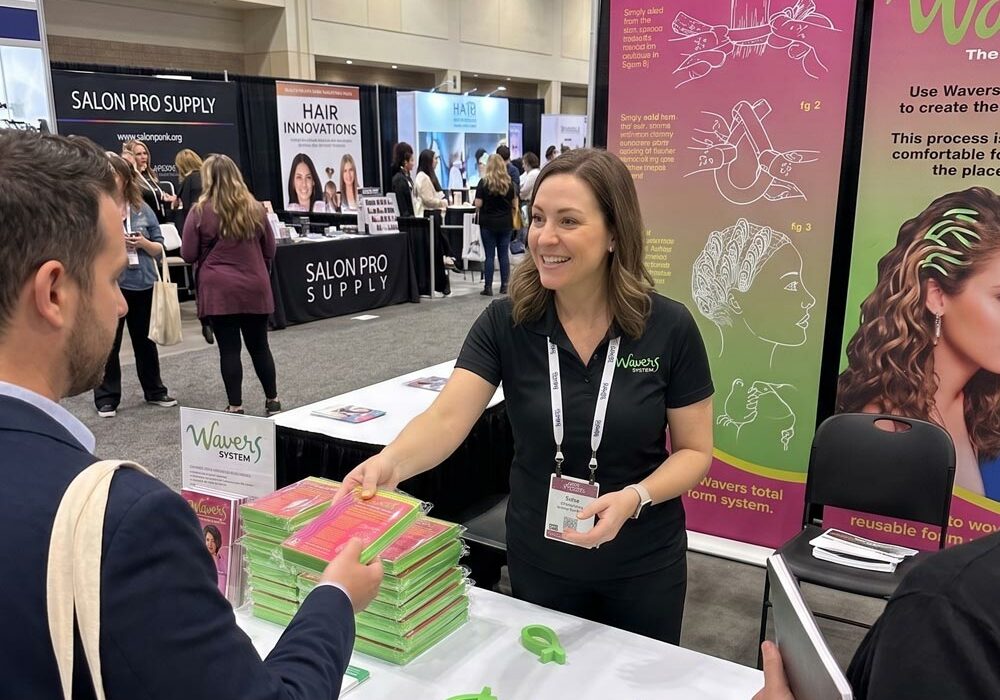 Promotional foam A person handling promotional foam products at a trade show